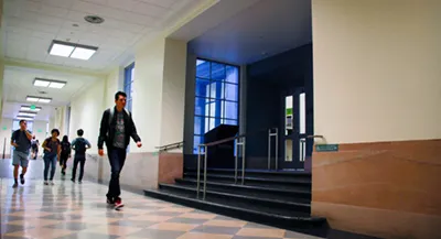 People walk in hallway near ILL